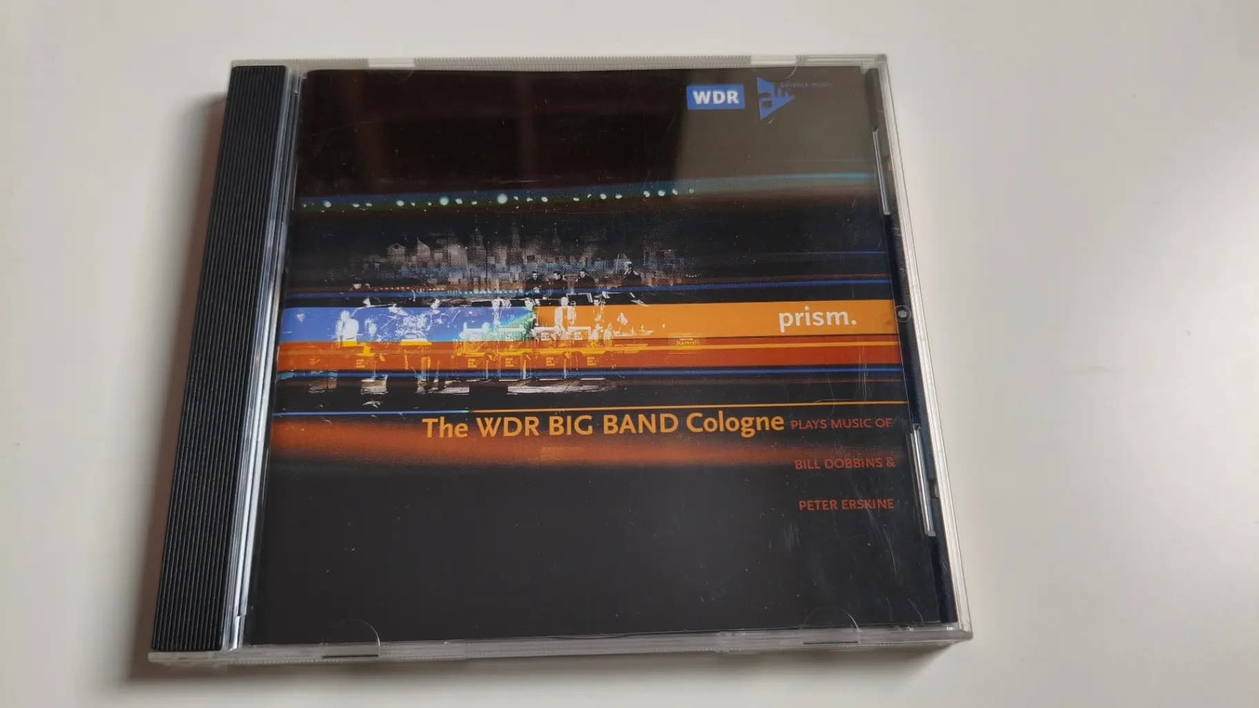 Okładka płyty WDR Big Band Köln - Prism. (Plays Music Of Bill Dobbins & Peter Erskine)